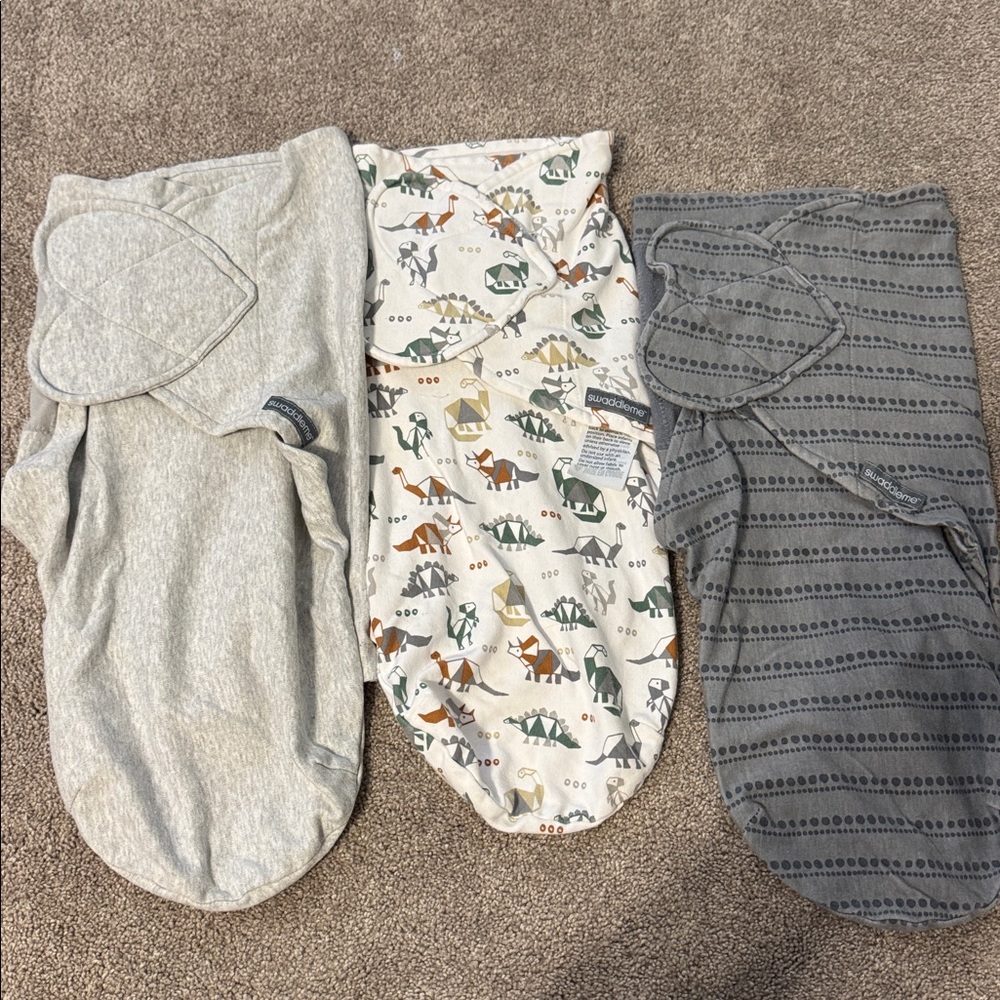 3 SwaddleMe Baby Swaddles in Gray, Cream, and Dark Gray. 0-3 months old; 7-14lbs